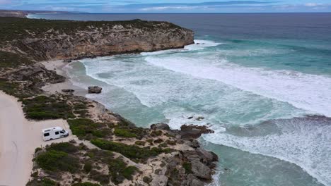 Kangaroo-Island-Pennington-Bay-aerial-with-white-camper-van,-waves-and-coast,-South-Australia