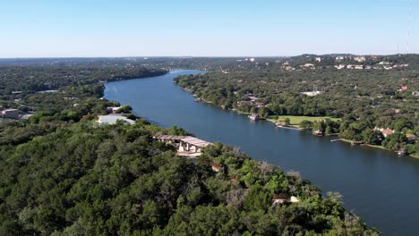 Aerial-drone-rotating-shot-over-Covert-Park-on-Mount-Bonnell-beside-Colorado-River-in-Austin,-Texas-at-daytime