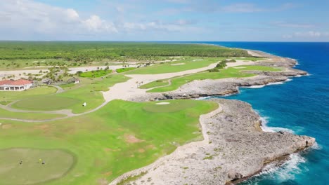 Corales-Golf-Course-on-cliffs-along-rocky-coast,-Punta-Cana-Resort-in-Dominican-Republic