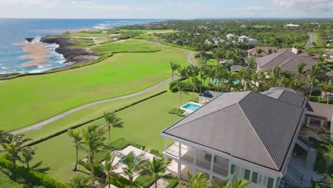 Luxury-Villas-With-Swimming-Pools-In-Corales-Golf-Course,-Puntacana-Resort-And-Club-In-Dominican-Republic---aerial-drone-shot