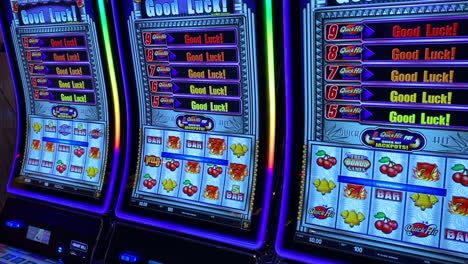 Colorful-lights-on-slot-machines-with-good-luck-message-on-cruise-ship-casino