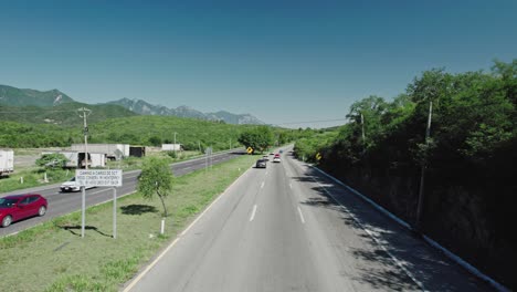 AERIAL---Road-highway-on-the-way-to-Santiago,-Nuevo-León,-Mexico,-high-speed-forward