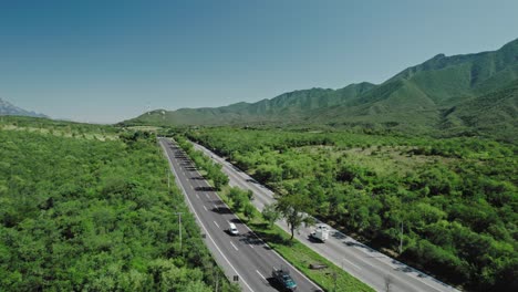 AERIAL---Road-highway-on-the-way-to-Santiago,-Nuevo-León,-Mexico,-reverse-reveal