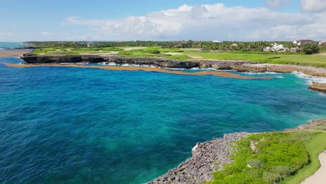 People-play-golf-on-Corales-Golf-Course,-Punta-Cana-Resort-in-Dominican-Republic