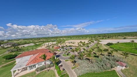 Aerial-fpv-flight-over-golf-course-at-Corales-Golf-Club-in-Punta-Cana-during-sunny-day