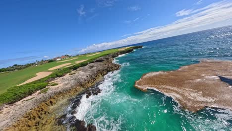 People-play-golf-seaside-at-Corales-Golf-Course,-Punta-Cana-Resort-in-Dominican-Republic