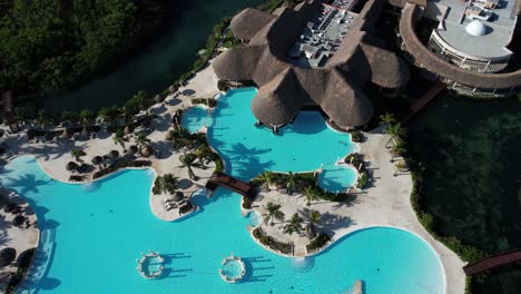 Luxury-Tropical-Resort-Hotel-and-Spa-in-Mexico,-Birds-Eye-Aerial-View-of-Pool-and-Rainorest