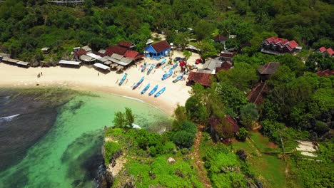 Aerial-top-down-shot-of-tropical-beach-with-parking-fisherman-boats-on-sandy-beach---Central-Java,Indonesia