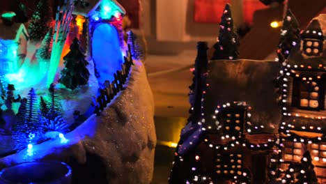Shot-of-Christmas-interior-home-decorations-on-stage-with-skiing-and-flying-Santa-animatronics-on-dispalay