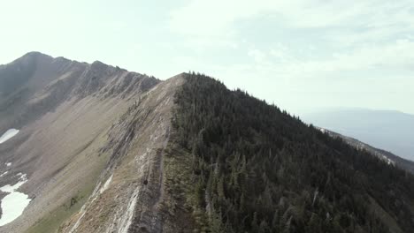 A-solo-hiker-walking-the-spine-of-a-mountain-in-Montana