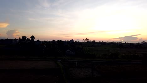 Yellow,-Pink-Blue-Sky,-Rising-Sun-Bali-Indonesia-Sky-Backlit-Rice-Fields-Morning-Magical-Time-Lapse