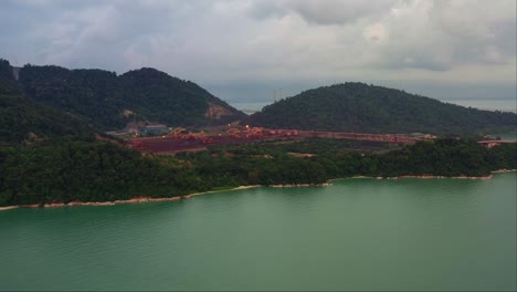 Aerial-forward-flying-capturing-Vale-iron-ore-distribution-centre-in-Seri-Manjung,-Perak,-Malaysia-as-an-integral-supply-chain-strategy-in-Asia-Pacific-region,-lumut-port,-teluk-rubiah-terminal