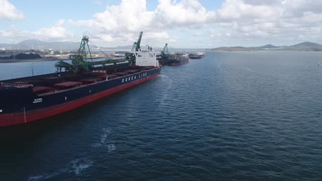 Drone-shot-of-Large-Coal-Ships-docked-in-Port,-Gladstone-Queensland-Australia