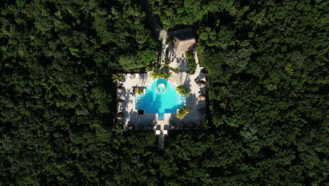 Top-Down-Aerial-View-of-Private-Villa-With-Swimming-Pool-in-Tropical-Rainforest
