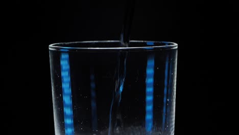 A-glass-of-sparkling-water-on-a-black-background