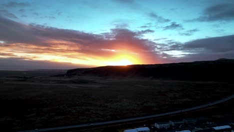 Scenic-Sunset-In-Hveragerdi-Town,-South-Iceland---aerial-drone-shot