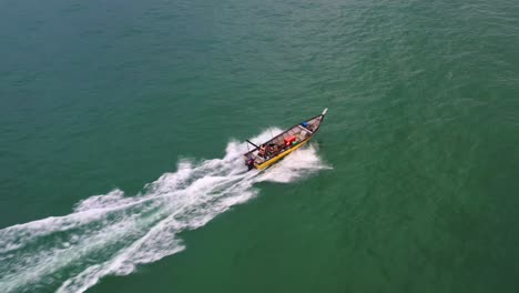 Aerial-birds-eye-view-capturing-small-traditional-fishing-boat-sailing-on-the-sea,-Lumut,-Pangkor-island,-Perak,-Malaysia,-Southeast-Asia