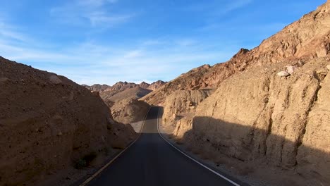 Dip-on-Paved-Road-in-Death-Valley-National-Park-with-stunning-landscape