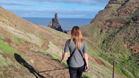 pretty-shot-of-a-middle-aged-woman-walking-on-the-paths-of-the-so-called-ponta-de-são-Lorenzo,-on-the-island-of-Madeira,-Portugal