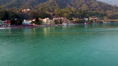 city-situated-around-holy-ganges-river-at-evening-video-is-taken-at-rishikesh-uttrakhand-india-on-Mar-15-2022