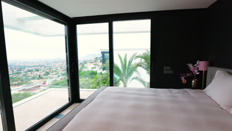 Elegant-Queen-Size-Bed-In-Villa-With-Floor-To-Ceiling-Windows-Overlooking-Calp,-Spain