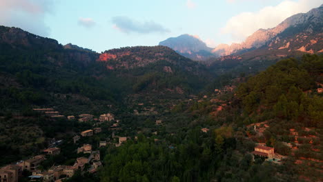 Dramatic-Sunset-Aerial-View-Of-Serra-De-Tramuntana-Mountains-With-Town-Of-Fornalutx-Below