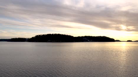 Lake-at-sunset,-peaceful-and-calm.-Scandinavian-landscape
