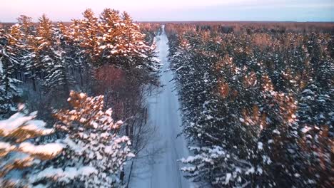 Winter-Forested-Road-Aerial-Flythough---Michigan