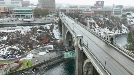 Aerial-view-of-the-Monroe-Street-Bridge-in-Spokane-Washington-with-a-fresh-layer-of-snow-on-the-ground