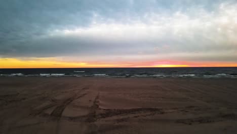 Rising-over-the-sandy-beaches-of-Michigan-during-a-fall-sunset
