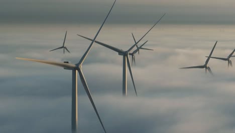 Unreal-drone-view---wind-turbines-rotating-above-clouds
