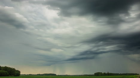 Rain-clouds-over-the-farmland---Time-lapse