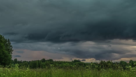 Emerging-of-dark-dense-clouds-at-sky-in-wilderness,time-lapse-shot