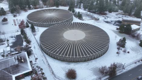 Aerial-view-of-a-large-suburban-water-reservoir-structure-during-the-winter