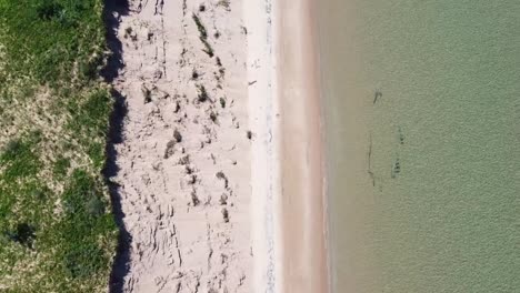 Topdown-Aerial-of-Beach-and-Small-Shipwreck