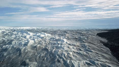 Aerial-view-over-the-icecap-at-pinot-660,-just-outside-Kangerlussuaq,-Greenland