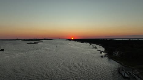 Aerial-pan-view-of-sunset-near-Wolf-Bay,-Alabama