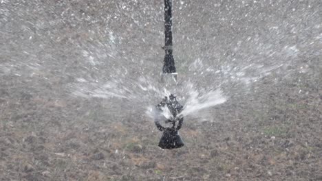 Close-Up-View-Of-Water-Being-Sprayed-From-oscillating-head-attached-to-Center-Pivot-Irrigation-system