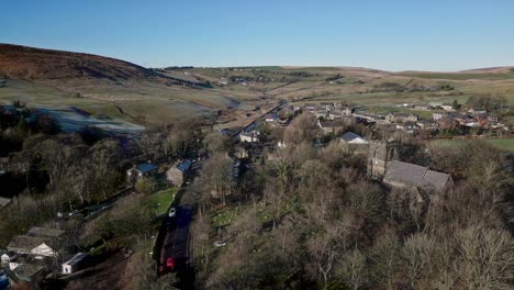 Aerial-drone-footage-of-the-village-of-Denshaw,-a-typical-rural-village-in-the-heart-of-the-Pennines