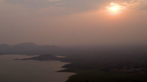 Sunset-over-lake-in-rural-area,-Rwanda,-Africa