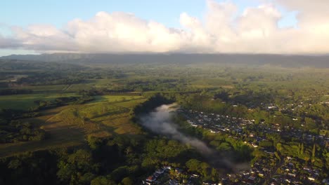 Mystic-and-foggy-Dramatic-drone-view-over-the-tropical-rainforest-of-Kauai,-Hawaii