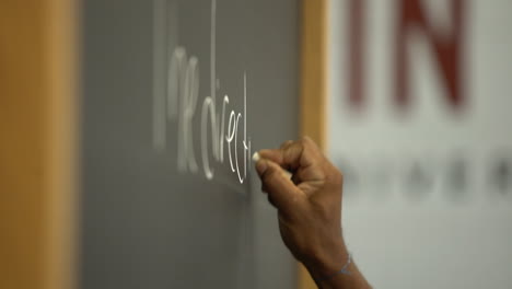 black-prisoner-african-american-inmate-writing-on-chalkboard-in-slow-motion-shot-on-Sony-A7III-mirrorless-camera