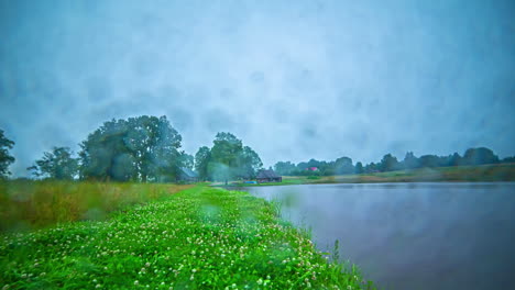 Wet-Weather-Clouds-Rolling-Over-River-In-Countryside