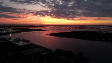 An-aerial-view-of-a-bay-on-Long-Island,-NY-during-a-golden-sunrise