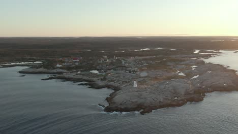 Sunrise-drone-shot-at-Peggy's-Cove-in-Nova-Scotia,-Canada