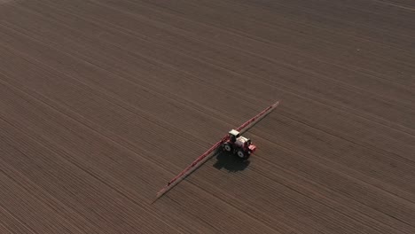 Agricultural-sprayer-wide-shot-of-farmer-working