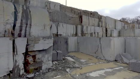 Camera-slowly-moves-forward-on-giant-granite-blocks-in-stone-quarry
