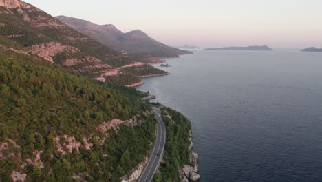 Scenic-Croatia-coastline-with-D8-state-road-highway-along-shore,-mountainous-landscape