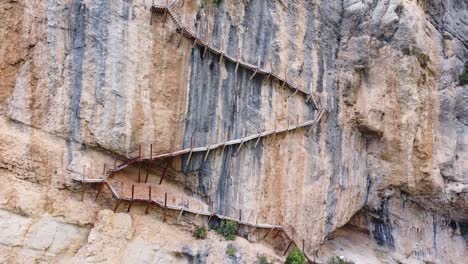 Pasarelas-de-Montfalco-at-Congost-de-Mont-Rebei-Canyon,-Catalonia-and-Aragon,-North-Spain---Aerial-Drone-View-of-the-Dangerous-Scary-Stairs-and-Hike-Trail-along-the-Steep-Cliffs