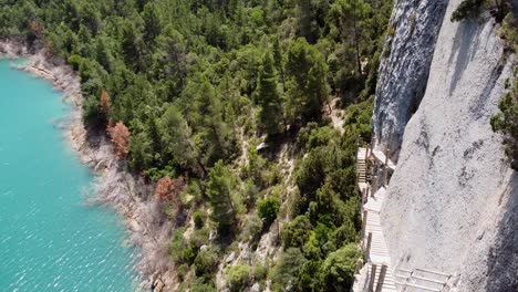 Pasarelas-de-Montfalco-Hike-at-Congost-de-Mont-Rebei-Canyon,-Catalonia-and-Aragon,-North-Spain---Aerial-Drone-View-of-the-Scary-and-Dangerous-Stairs-along-the-Steep-Cliffs